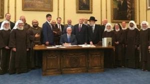 Indiana Governor Mike Pence signs the Religious Freedom Restoration Act