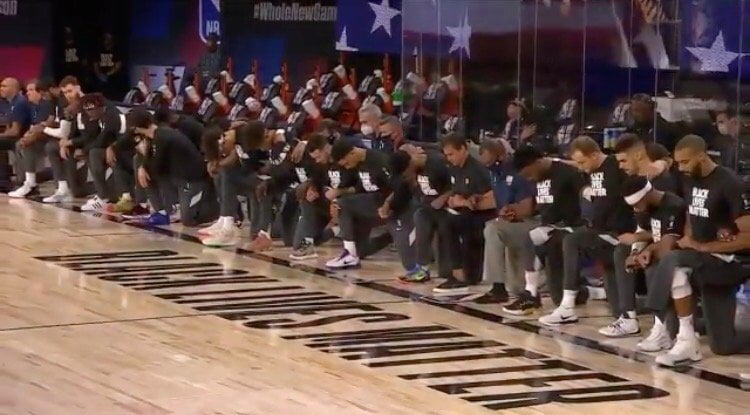 Every Player, Coach and Ref Takes a Knee During National Anthem of First NBA Game Back